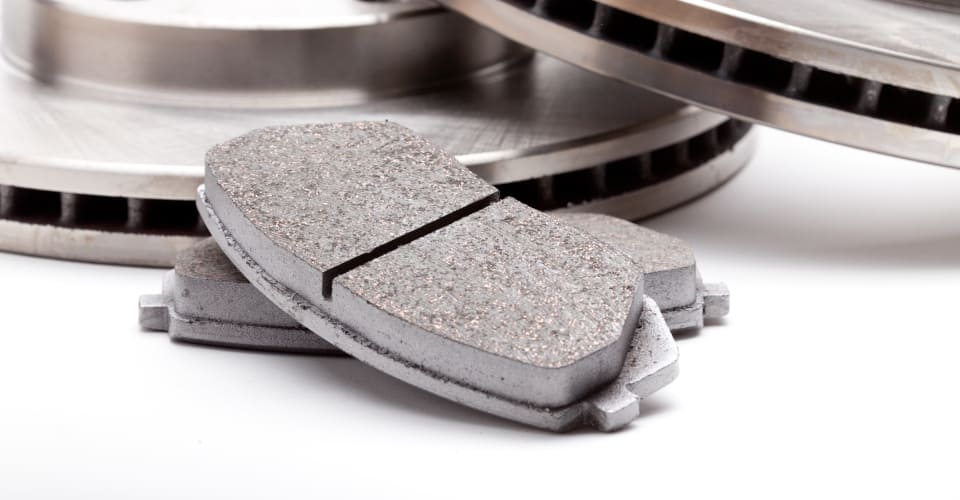 brake pads with brake disks in the background 1