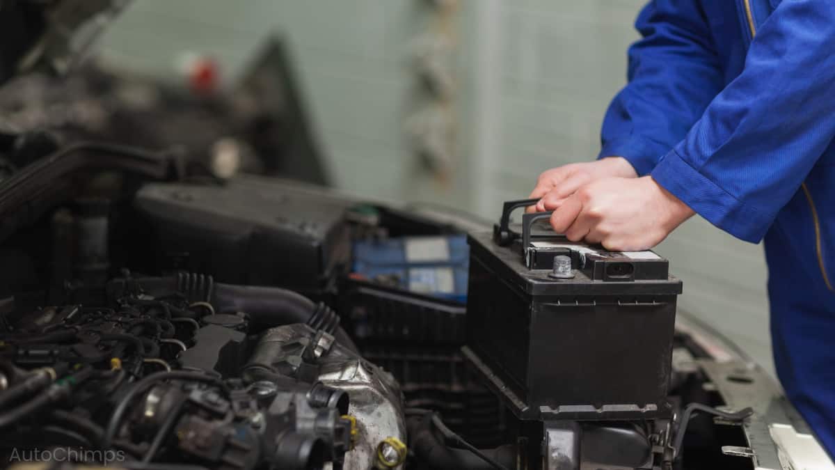 mechanic changing car battery 1