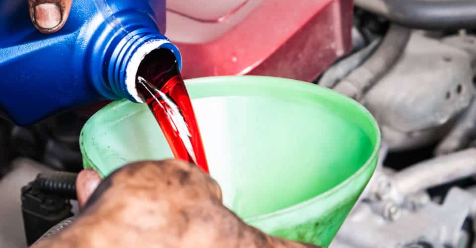 pouring transmission fluid through funnel 1